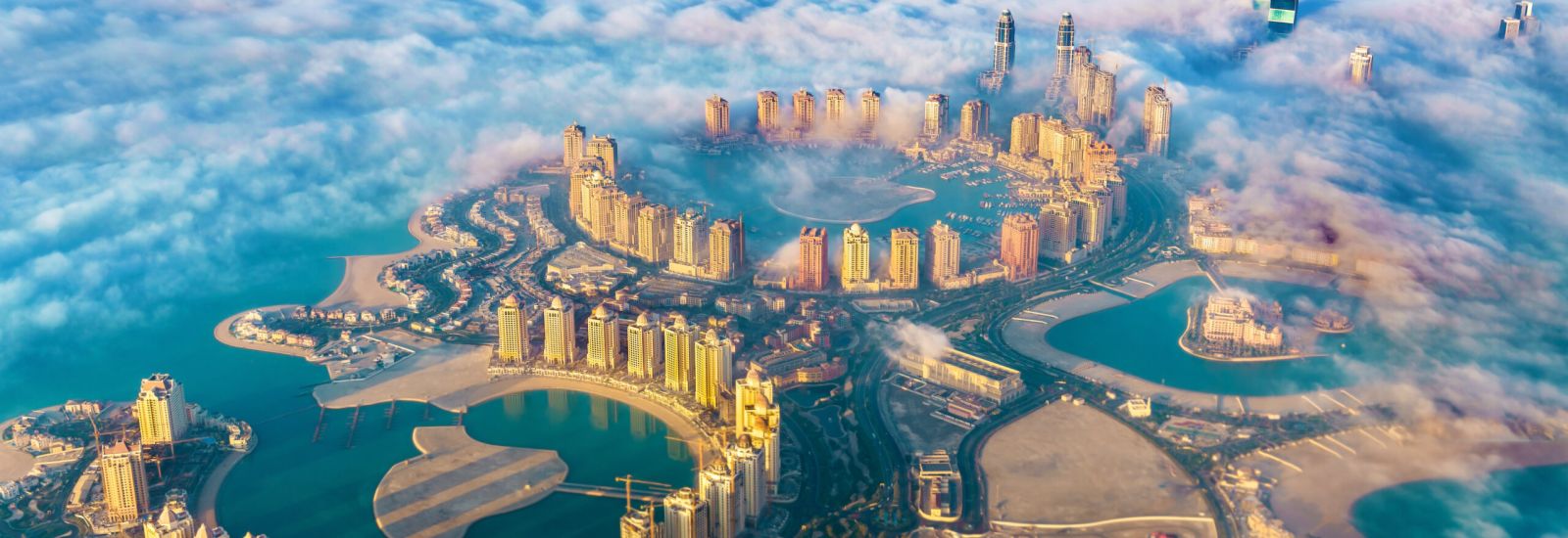 Aerial view of the Pearl-Qatar island in Doha through the morning fog