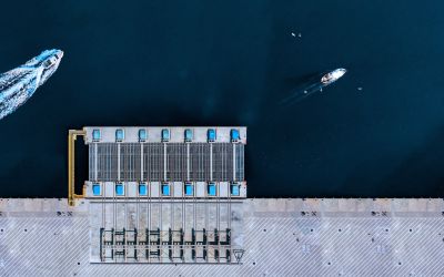 Aerial View of dock, with boats driving by Aerial View of dock, with boats driving by