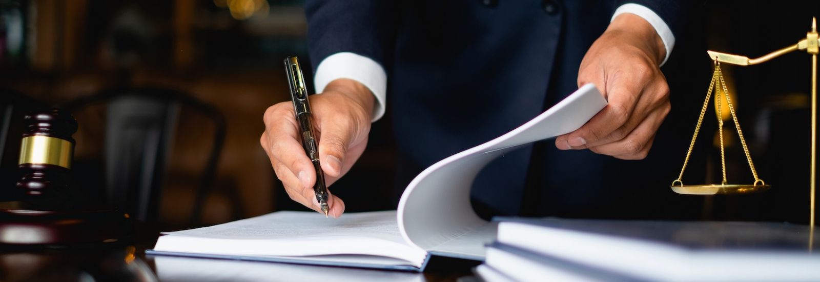 Close up of businessmans hands, working on a document