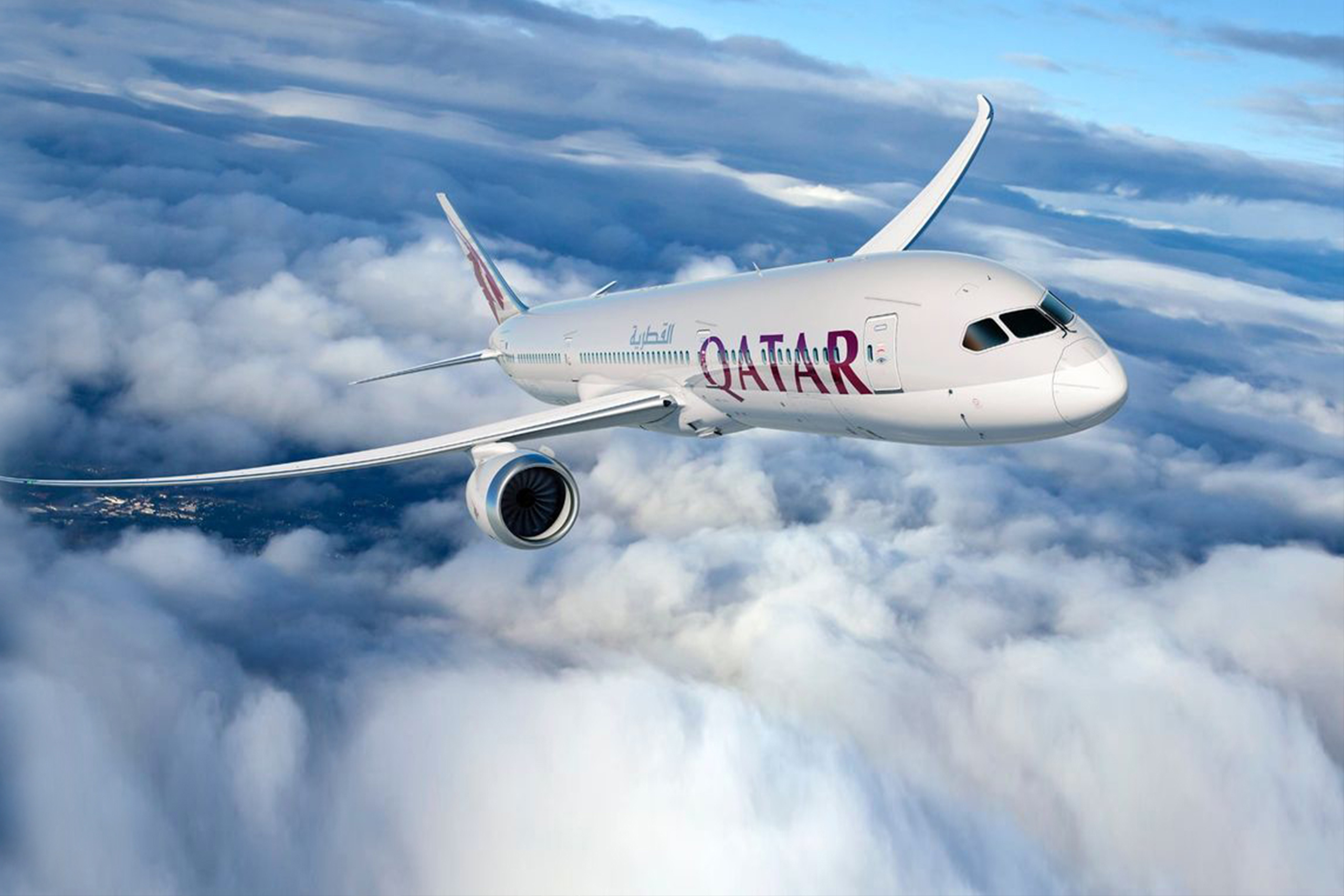 Qatar Airways plane soaring above the clouds